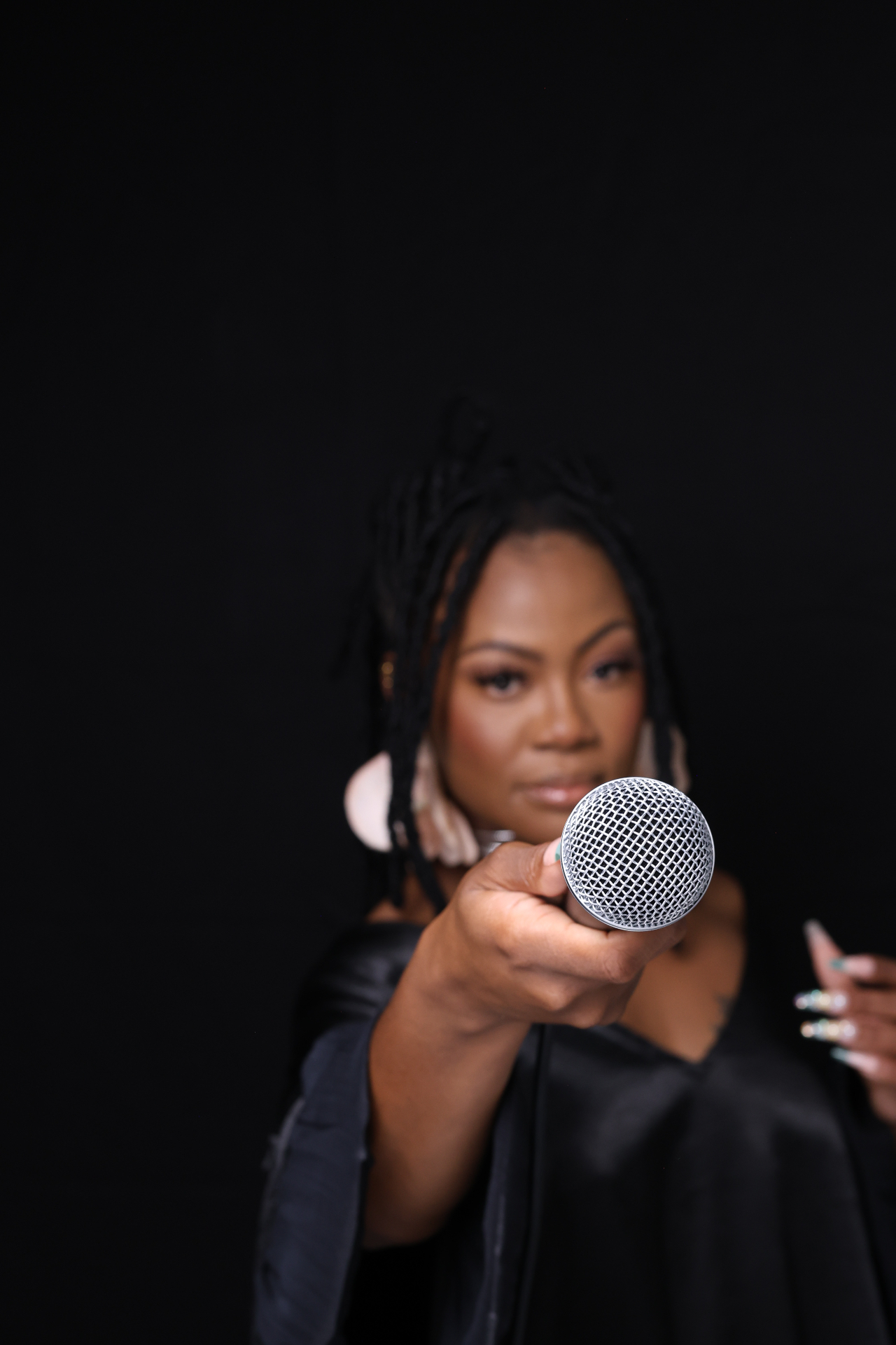 Studio portrait with microphone